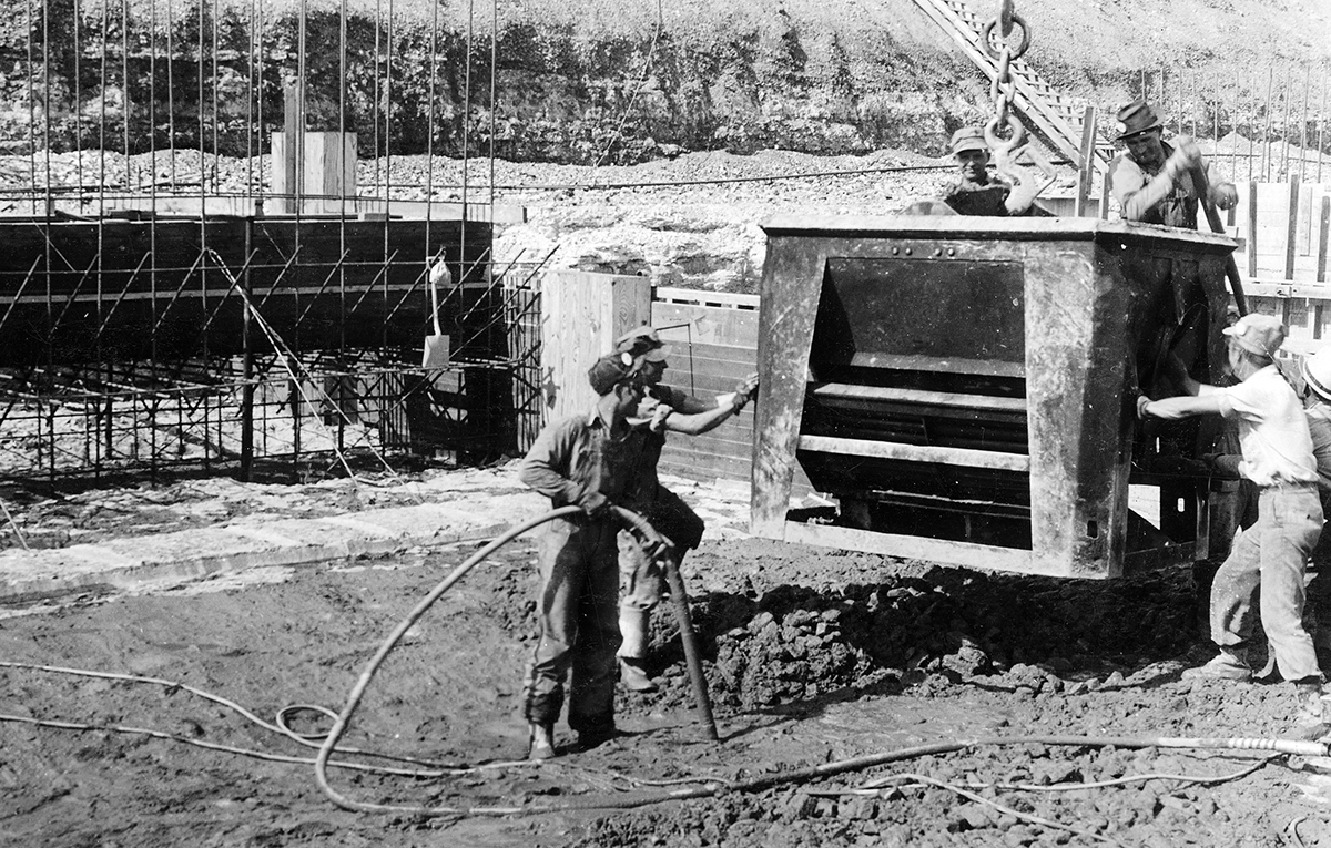 This is man's deed ... Over 86 years ago, approximately 3,000 men and women helped to construct Pensacola Dam. A few of those workers are pictured here, pouring concrete in the dam's main spillway area in the summer of 1939.