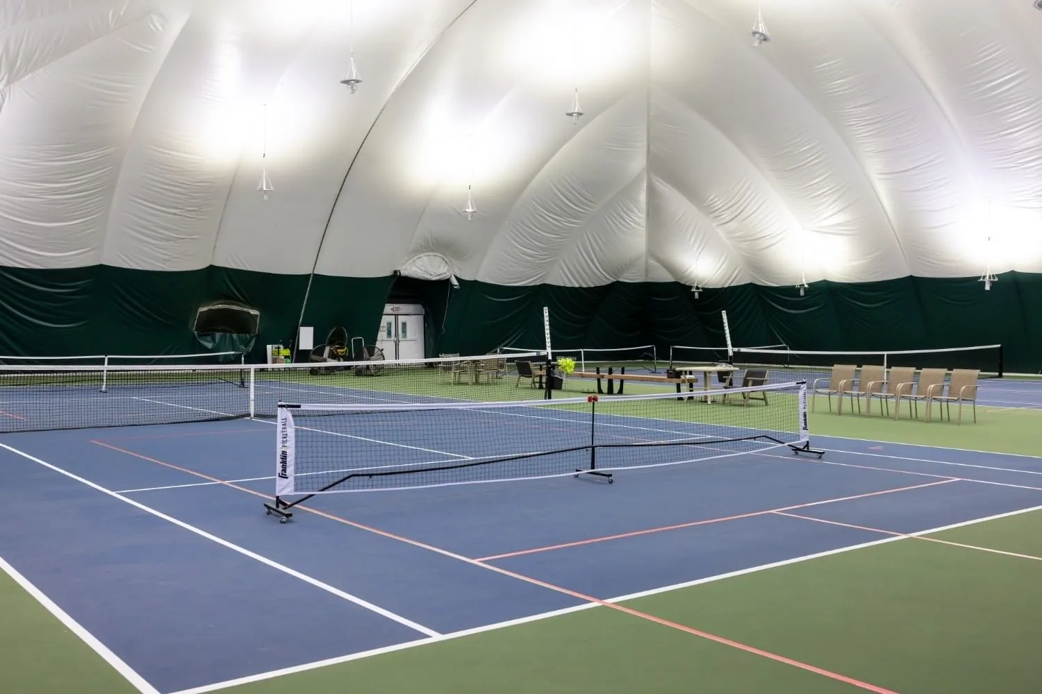 Indoor pickleball courts under the Racquet Club dome at Shangri-La Resort